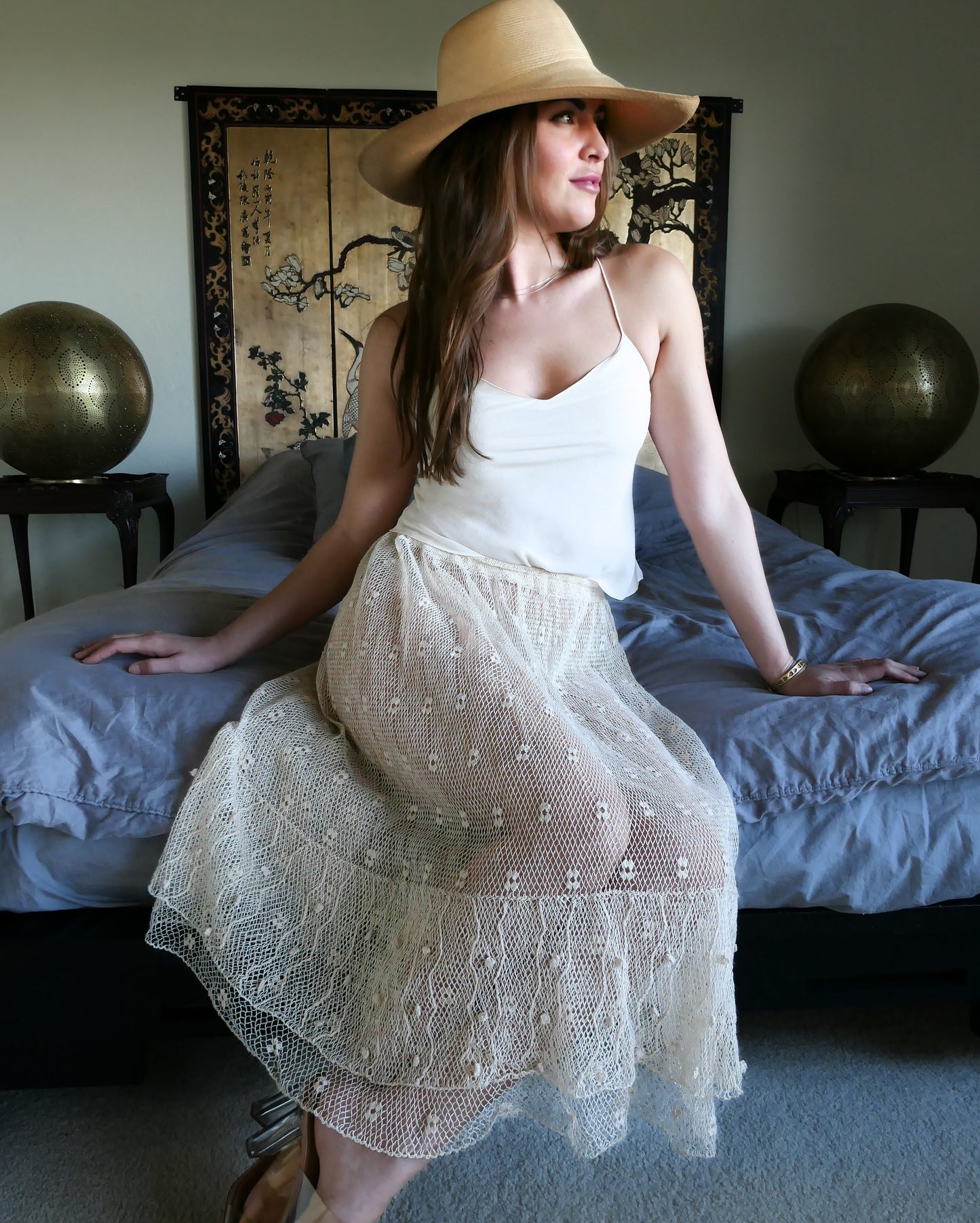 Like the delicate petals of the California Poppy, this skirt wafts and floats like a gentle summer breeze. Made with a delicate fishnet crochet, dotted with mini florettes, and accented with a two-tiered ruffle hem, this dress is sure to sweep you off your feet! Comes with a comfortable fitting elastic waistband that rests easily on the waist. Great as a beach coverup with a pair of wedgy sandals, a cute straw hat, and a mojito in hand. Size: Fits small to medium