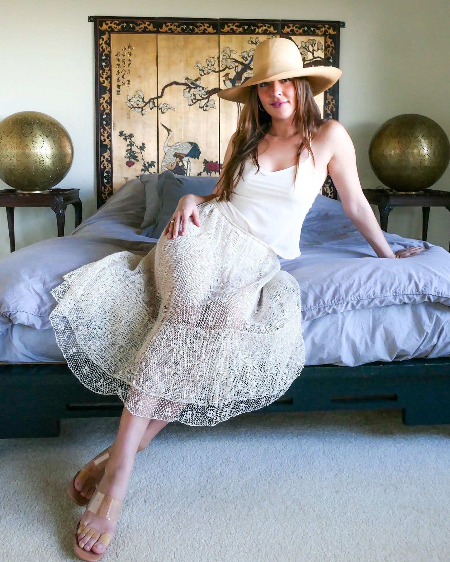 Like the delicate petals of the California Poppy, this skirt wafts and floats like a gentle summer breeze. Made with a delicate fishnet crochet, dotted with mini florettes, and accented with a two-tiered ruffle hem, this dress is sure to sweep you off your feet! Comes with a comfortable fitting elastic waistband that rests easily on the waist. Great as a beach coverup with a pair of wedgy sandals, a cute straw hat, and a mojito in hand. Size: Fits small to medium