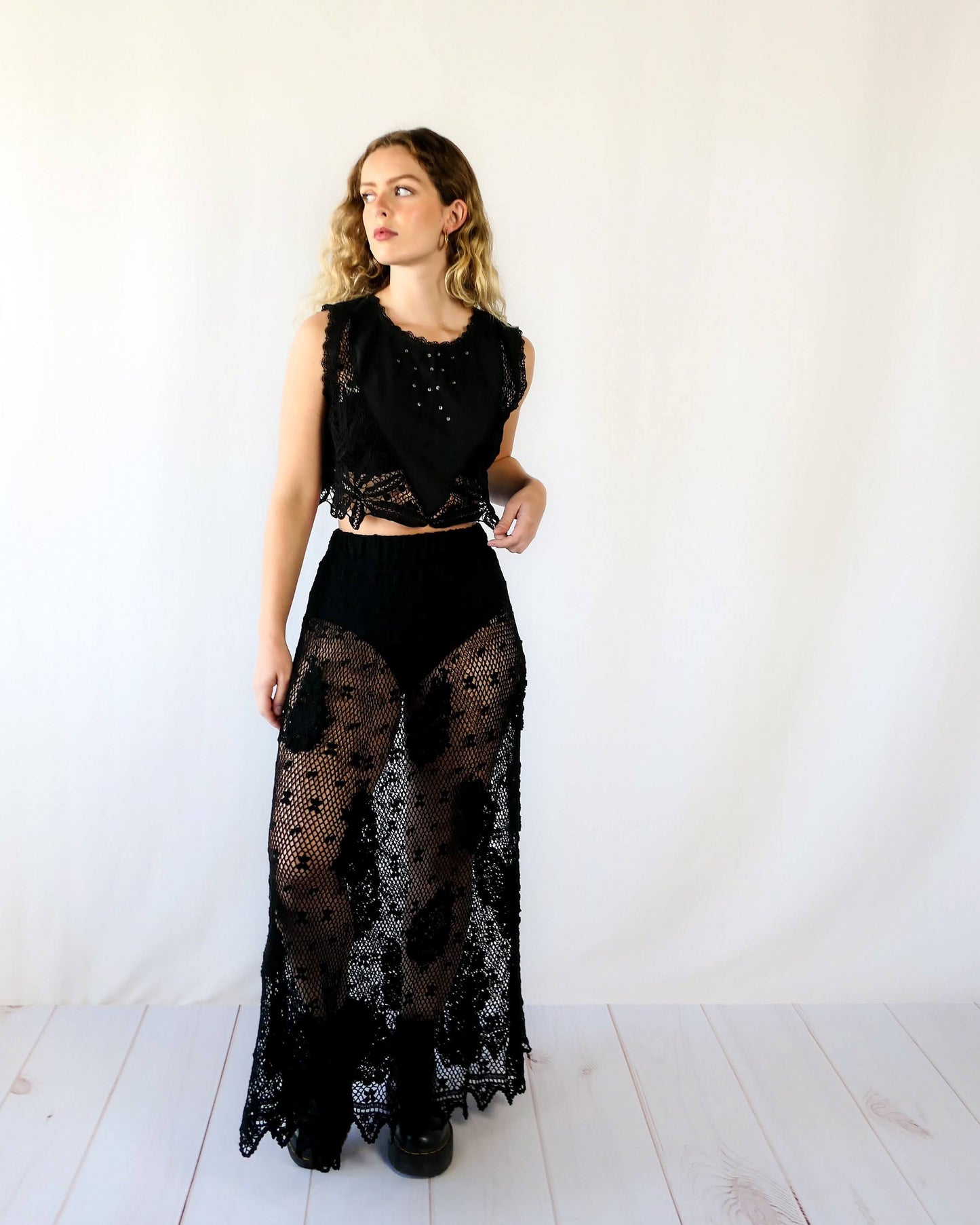 Hand crocheted, lightweight, flowy maxi length slip-on skirt with a comfortable elastic waist and a paisley and floral motif throughout. Makes for a great beach coverup! This is one of our original Lim’s crochet skirts from the 1990s. Measurements: X-Small to Small: Waist 22"- 28" Length 38" Hip 46" Medium to Large: Waist 28"- 36" Length 38" Hip 50" Color: Black Material: 100% cotton