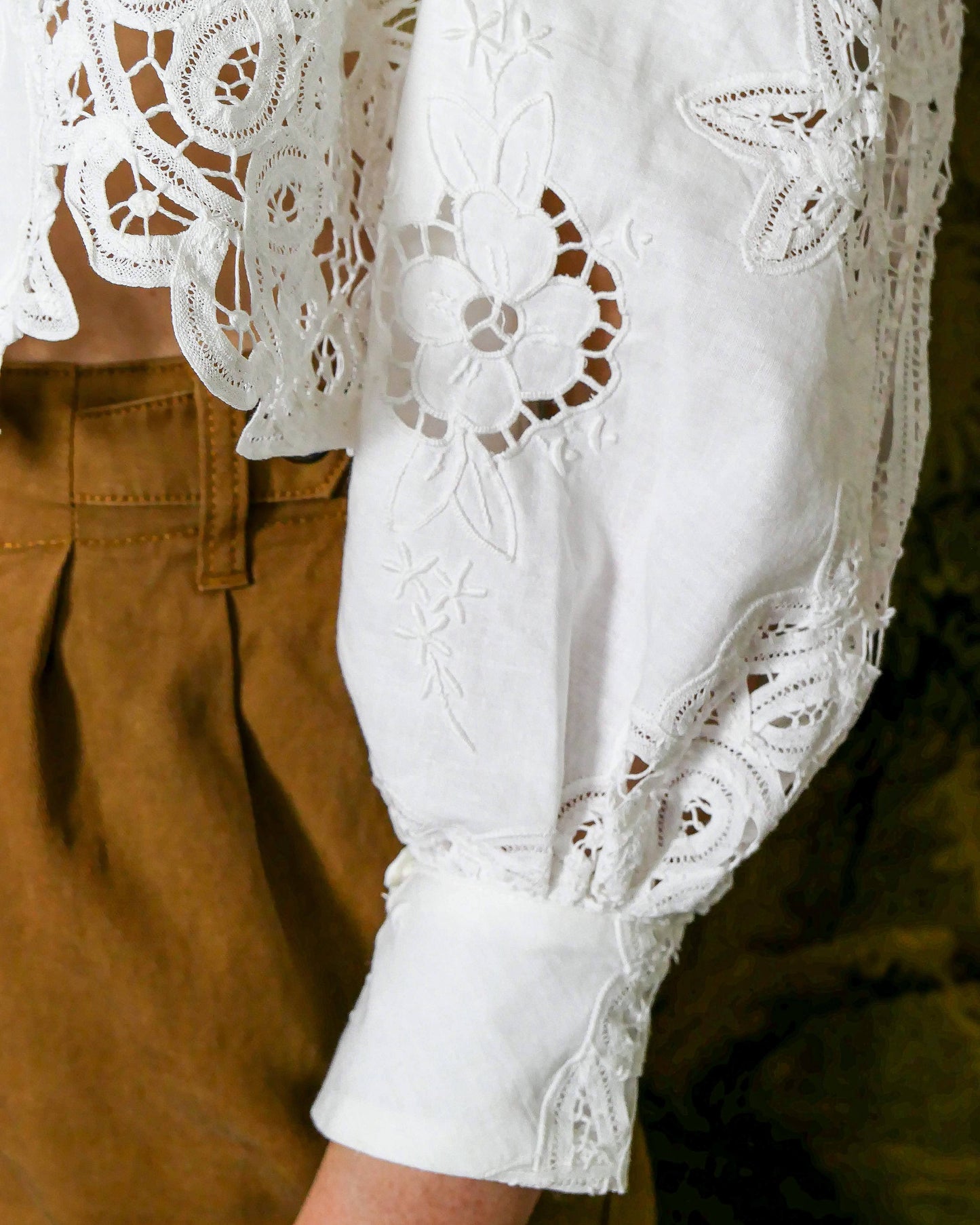 Chic, vintage, and one-of-a-kind, this semi crop top is made with our classic Lim's Vintage Battenberg lace. Comes with romantic puffed long sleeves and a scalloped hem. Wear it buttoned or unbuttoned with your favorite long skirt or wide leg jeans and boots, or dress it up with a pair of slacks and heels.