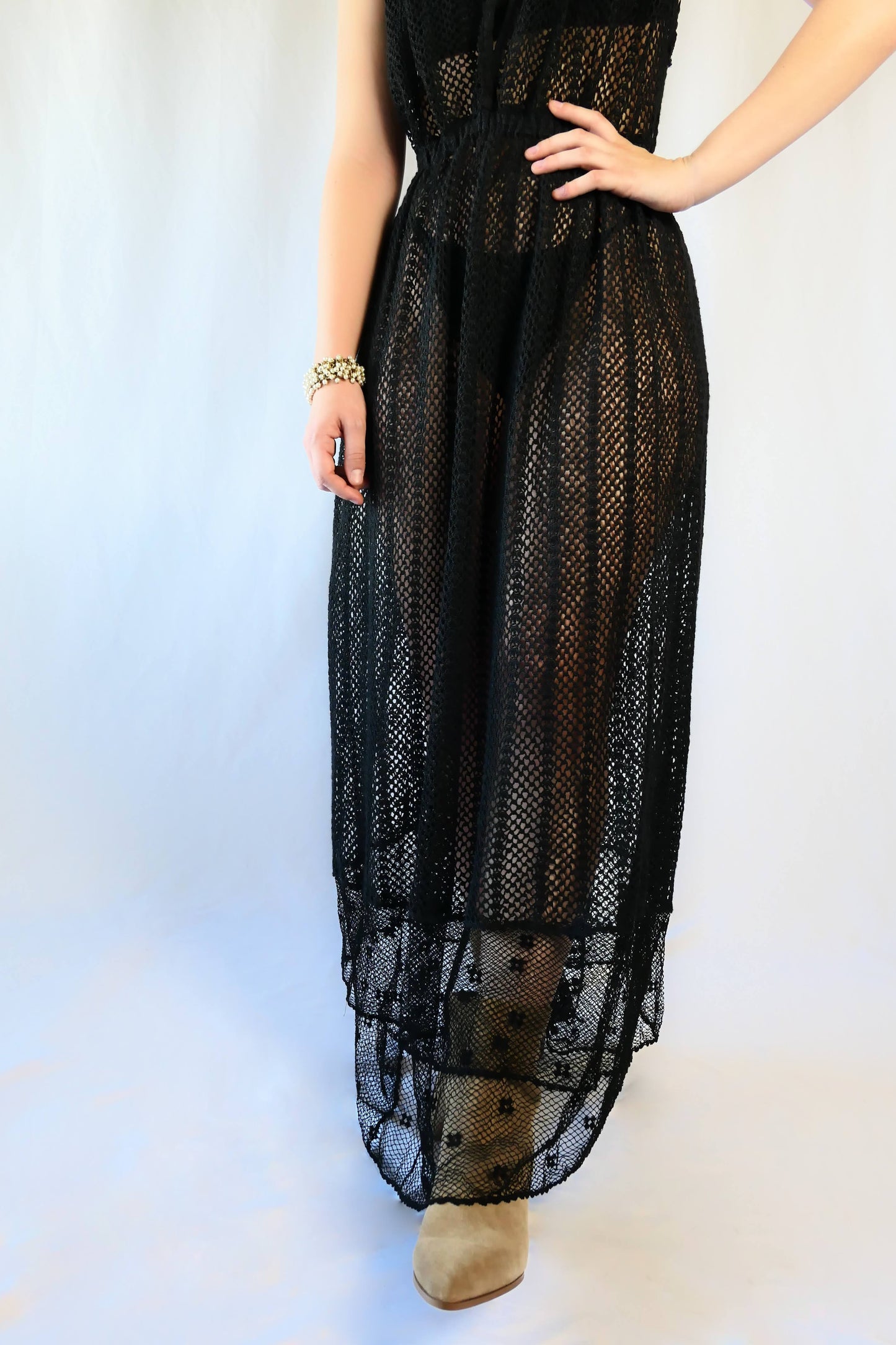 This boho chic dress in black is completely hand crocheted with soft cotton threads, with a Lim’s classic delicate net patterned crochet at the bottom hem. The dress is worn with the button open at the front for a flattering V-neckline.