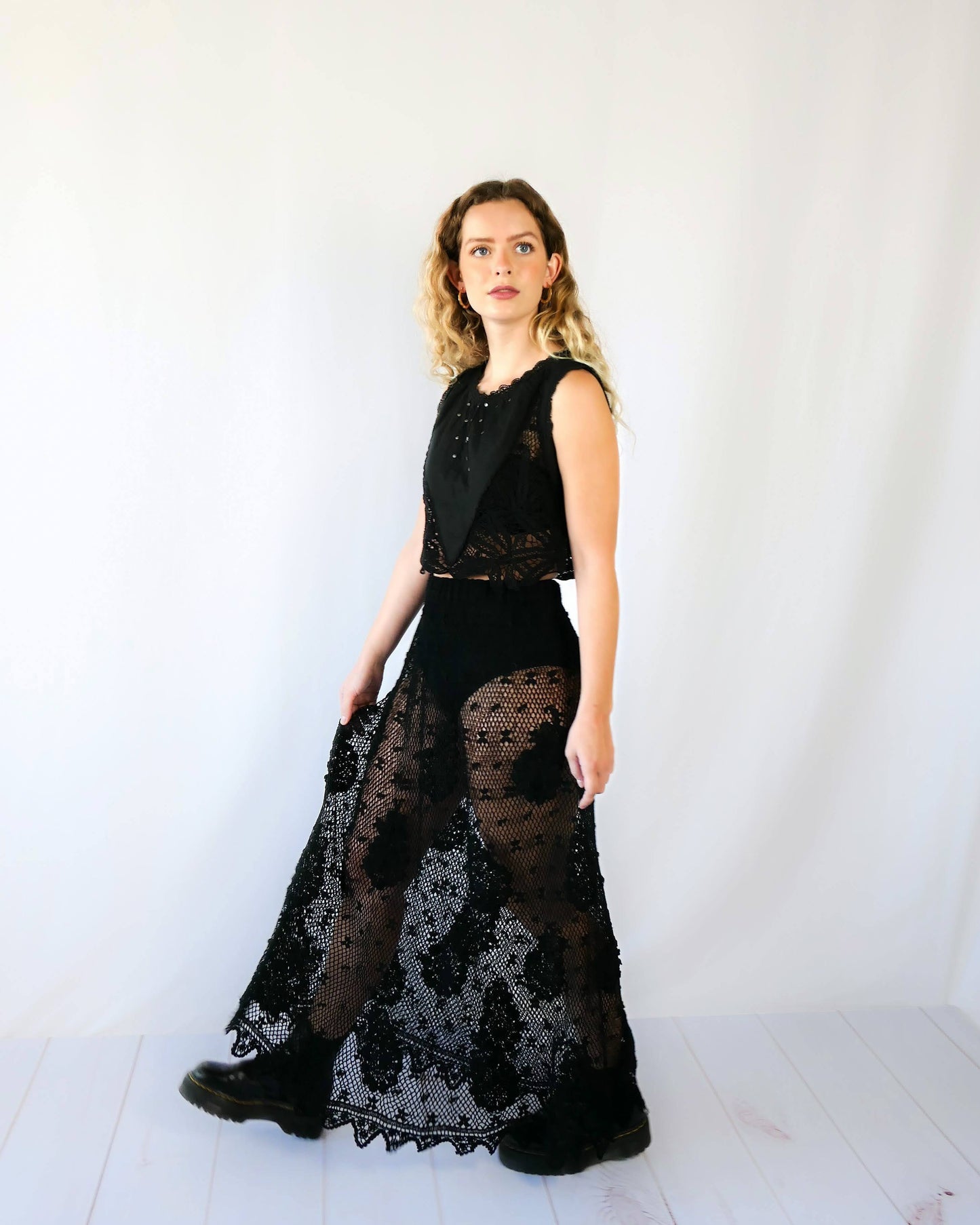 Hand crocheted, lightweight, flowy maxi length slip-on skirt with a comfortable elastic waist and a paisley and floral motif throughout. Makes for a great beach coverup! This is one of our original Lim’s crochet skirts from the 1990s. Measurements: X-Small to Small: Waist 22"- 28" Length 38" Hip 46" Medium to Large: Waist 28"- 36" Length 38" Hip 50" Color: Black Material: 100% cotton