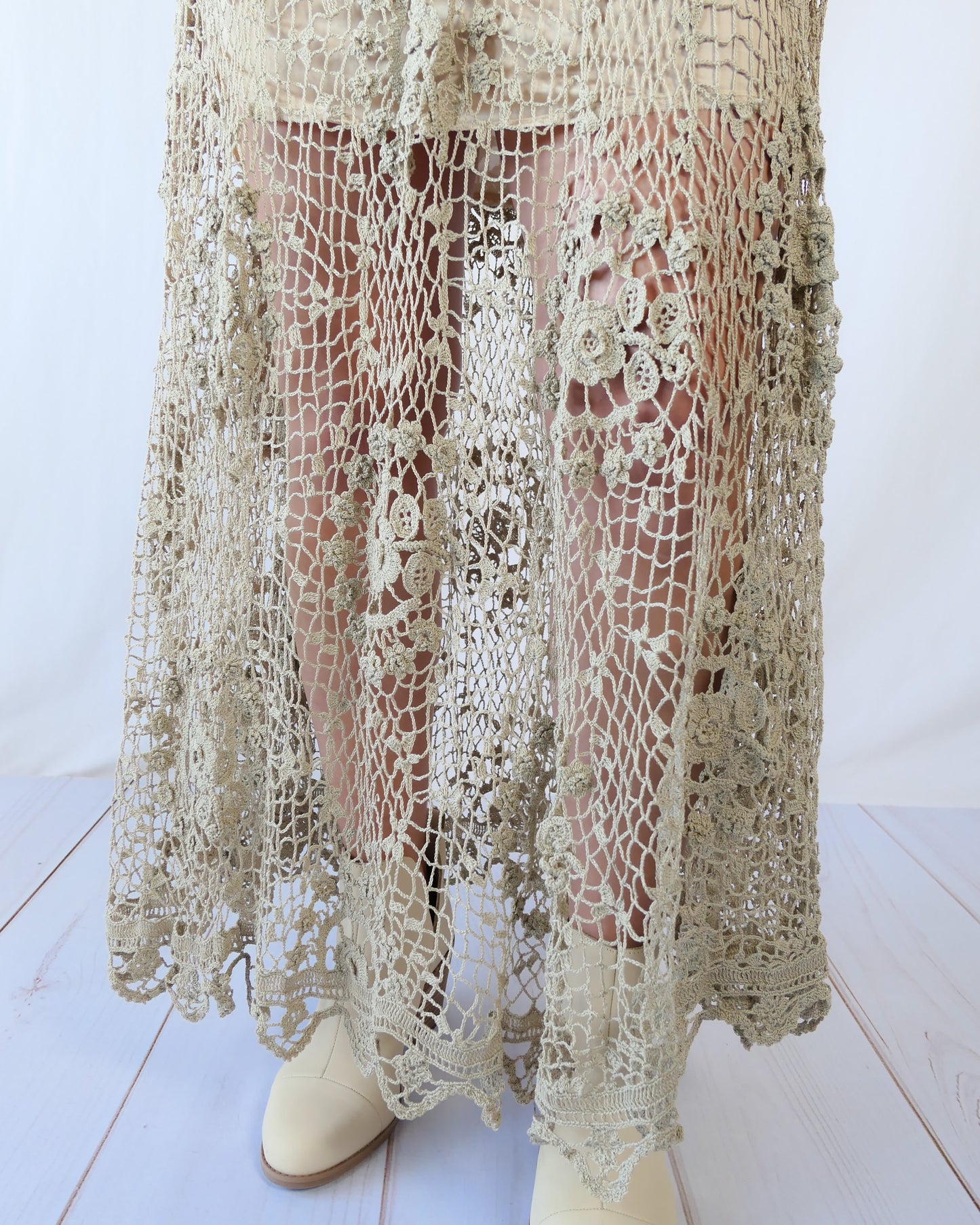The ultimate cowgirl romantic hand crocheted maxi skirt with a circular floral design against a fishnet-like backdrop. This is an original Lim's piece from the 1980s and is truly a vintage collector's item!