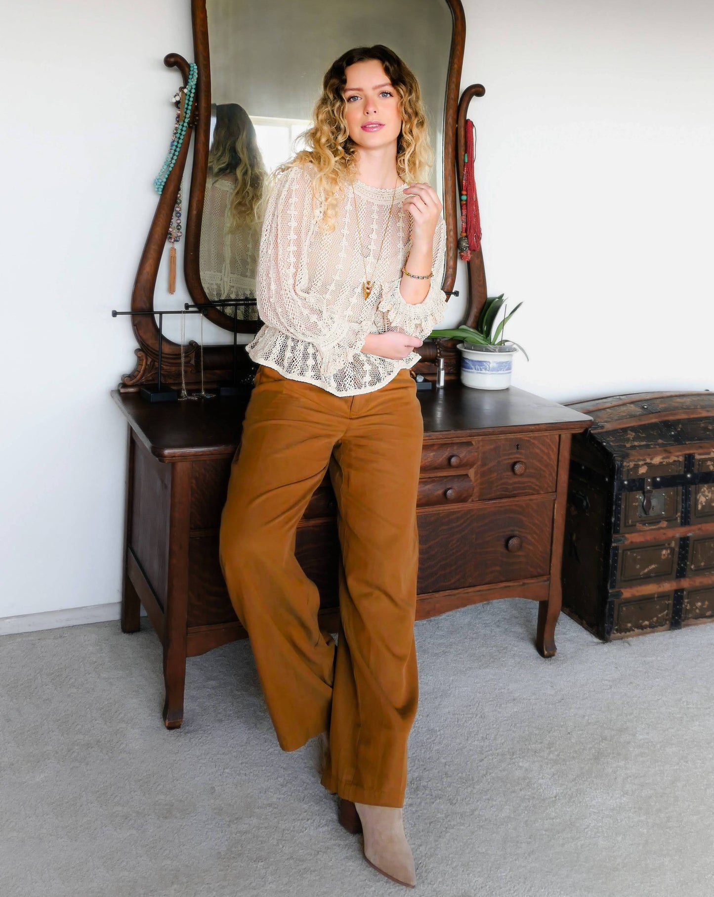 This feminine cottagecore style blouse was hand crocheted using fine cotton threads, with long puff sleeves and flared, ruffle trim on the sleeeves and hem. The blouse is reversible and can be buttoned up the front or back. This beautiful top is an original Lim's Vintage piece from the 1980s, and we have only a few of this limited edition item left. Wear with neutral colored trousers or denim wide leg jeans and a pair of boots, and you ready to turn heads.
