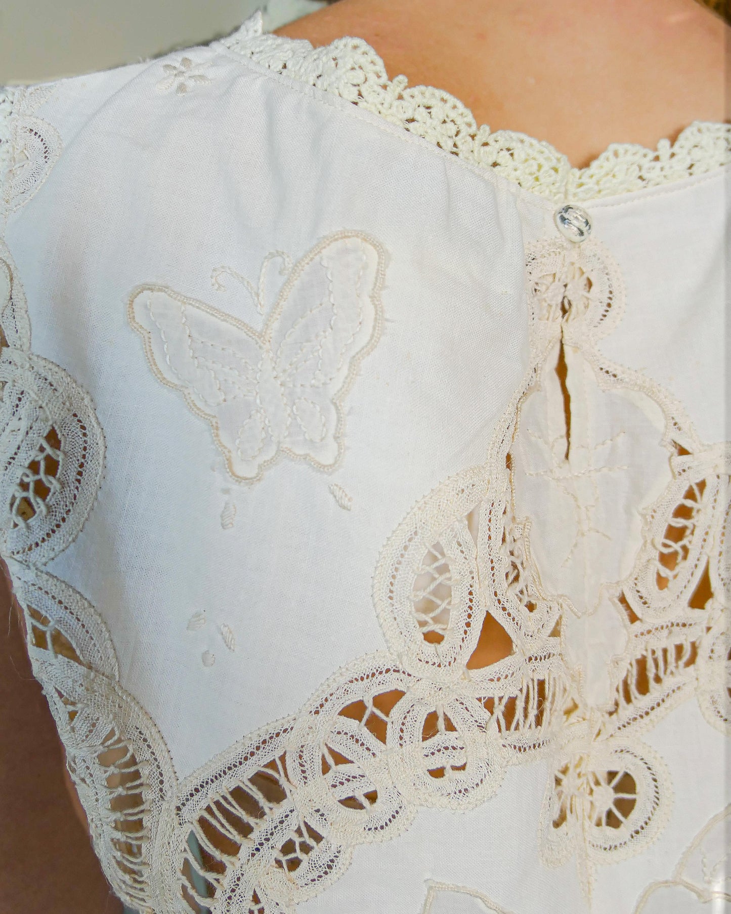 Romantic, boho chic, goes-with-everything crop tank top made with Lim's Vintage embroidered Battenberg lace fabric with a butterfly and floral motif. Goes well with jeans or denim skirt and cowboy boots or sandals.