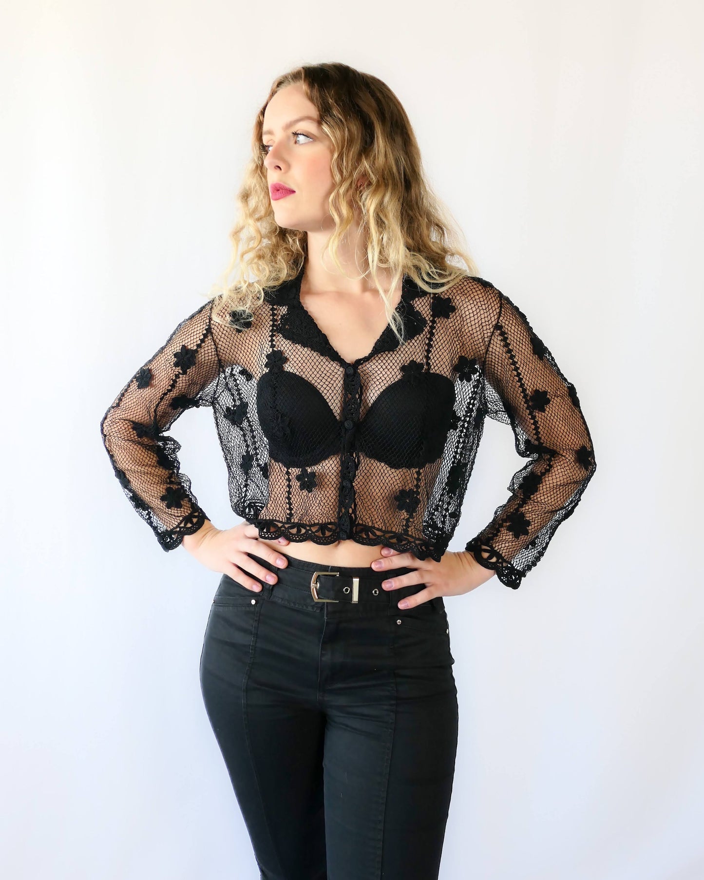 One of our original Lim's hand crocheted long sleeve cardigans from the 1990s, this versatile, semi-revealing cropped cardigan is casual yet provocative. Sheer, with a relaxed, easy fit and embellished with dainty hand crocheted flowers throughout. Dress it down with a pair of jeans and sandals, or dress it up with a pair of slacks or skirt and heels for a night out. Measurements: Bust 40" Length 17" Sleeves 20" Shoulder width 15" Hem 34" Color: Black Size: Medium Material: 55% linen 45% cotton