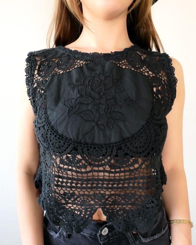 Get ready to rock and roll with our vintage crochet and embroidered patchwork crop tank top that has both an edgy and feminine vibe. We've used one of our vintage rose motif embroidered patchwork fabrics to make this limited edition, one-of-a-kind top. Looks great with a pair of black jeans, boots, and a cowboy hat.