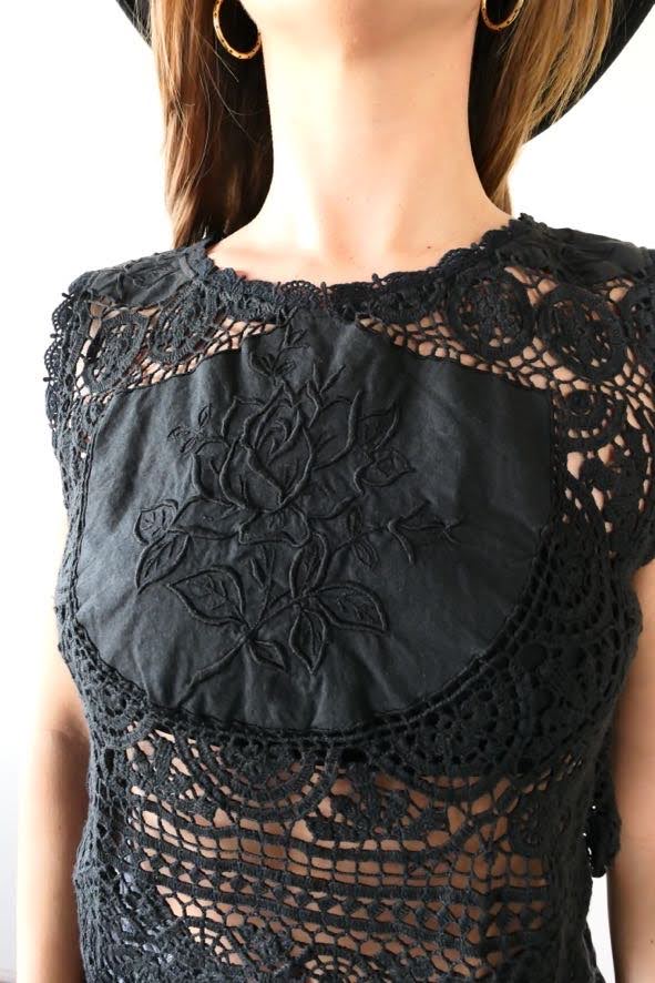 Get ready to rock and roll with our vintage crochet and embroidered patchwork crop tank top that has both an edgy and feminine vibe. We've used one of our vintage rose motif embroidered patchwork fabrics to make this limited edition, one-of-a-kind top. Looks great with a pair of black jeans, boots, and a cowboy hat.