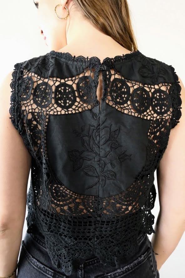 Back view of black crochet and embroidered patchwork tank top with rose embroidered motif. By Lim's Vintage.