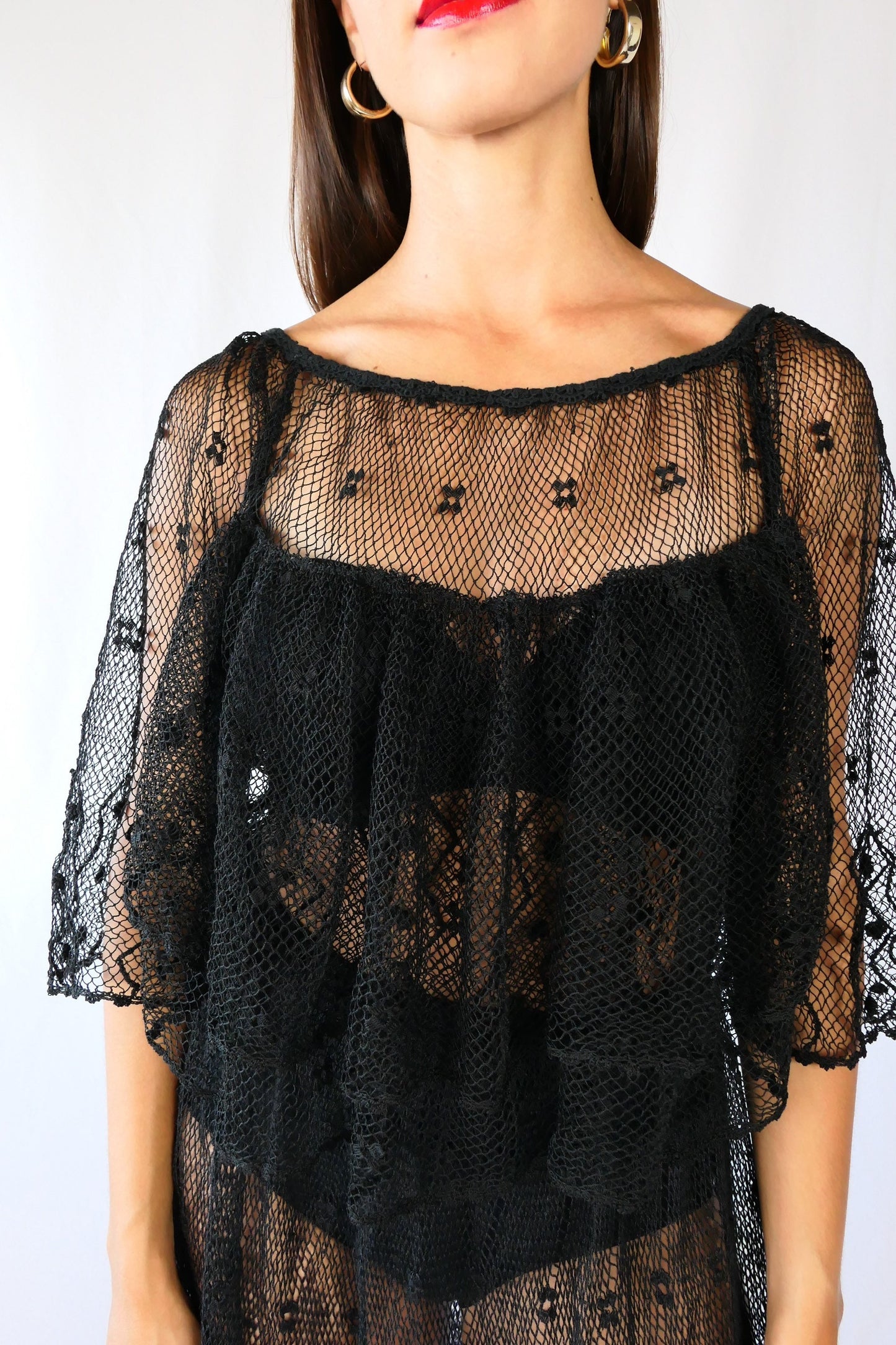closeup of front of dress. Ruffly layers at the front.