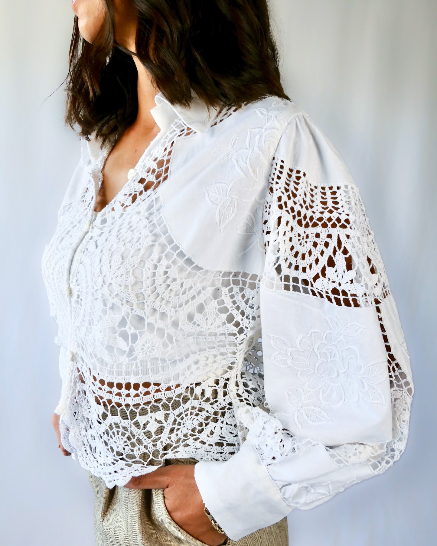 An almost-cropped, lightweight shirt using our vintage Lim's crochet and embroidered cotton fabric, with puff sleeves for a romantic twist. Pair it with high-waisted jeans for casual days, or try it with a flowing midi skirt or wide-legged trousers to dress it up.