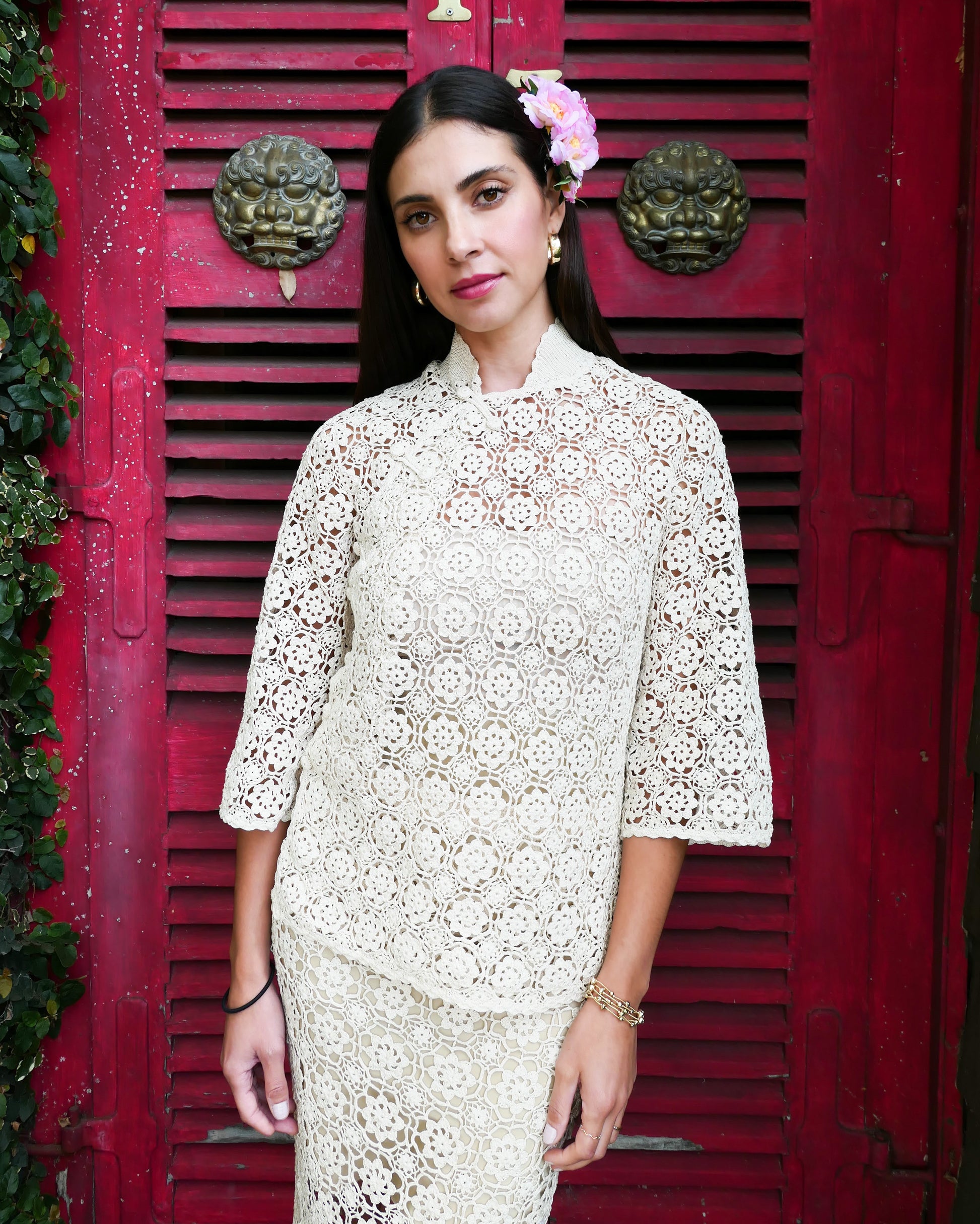 An intricately hand crocheted top and skirt set reminiscent of the traditional Chinese Qipao, with its high mandarin collar, traditional knotted buttons that run along the front and side of the top, and the side slits that run up either side of the skirt. Simple, refined, beautiful, and one of our classic Lim's Vintage bestsellers. Color: Natural