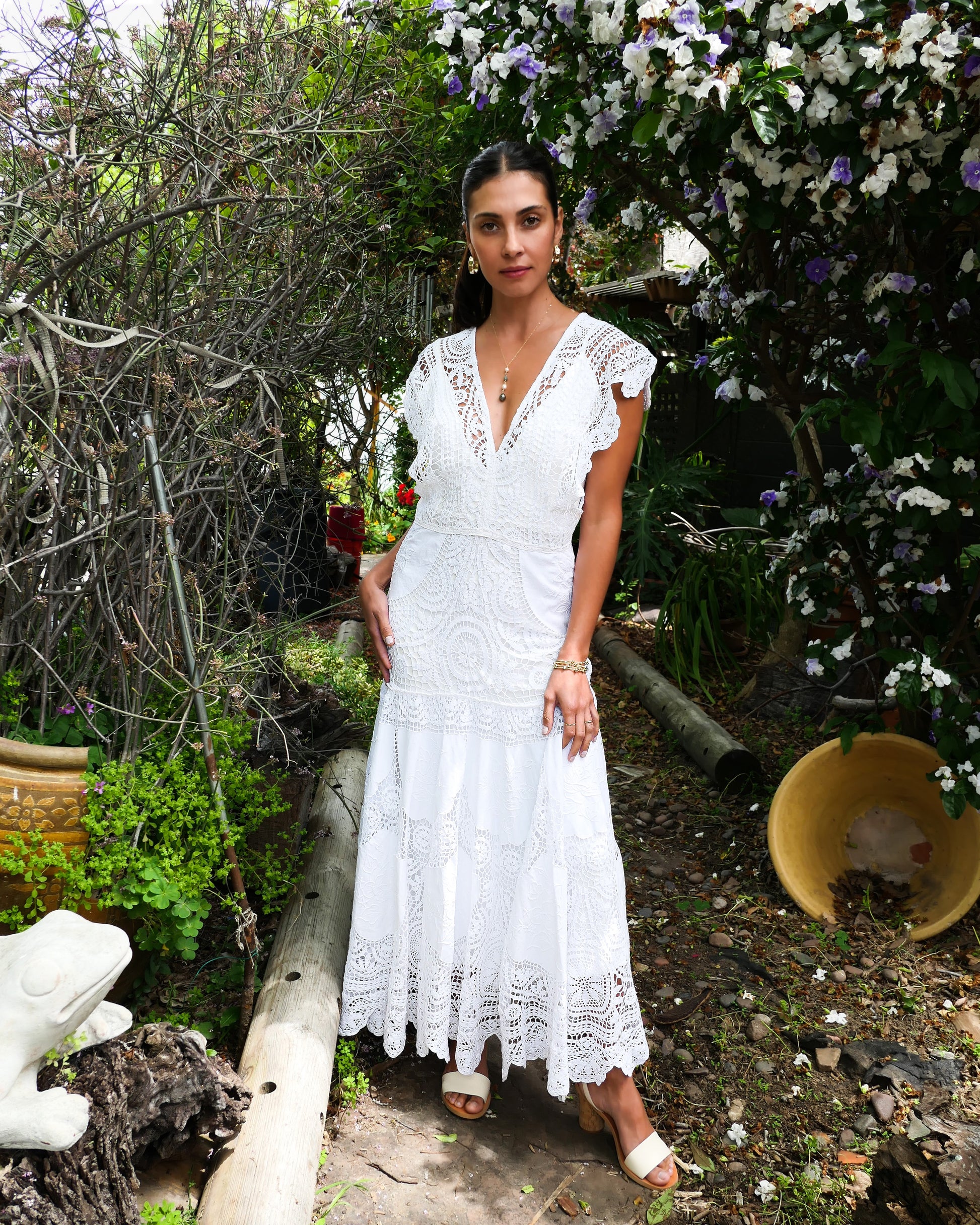 A romantic and elegantly seductive V-neck and V-back hand crocheted and embroidered patchwork maxi dress made with our signature Lim's Vintage fabric. This dress is fitted and flared at all the right places, accentuating your natural curves and perfect for your special wedding day or stylish summer beach party. Does not come with a slip, but we highly recommend wearing one due to the "holey" nature of the crochet. Color: White. Can be made to order.