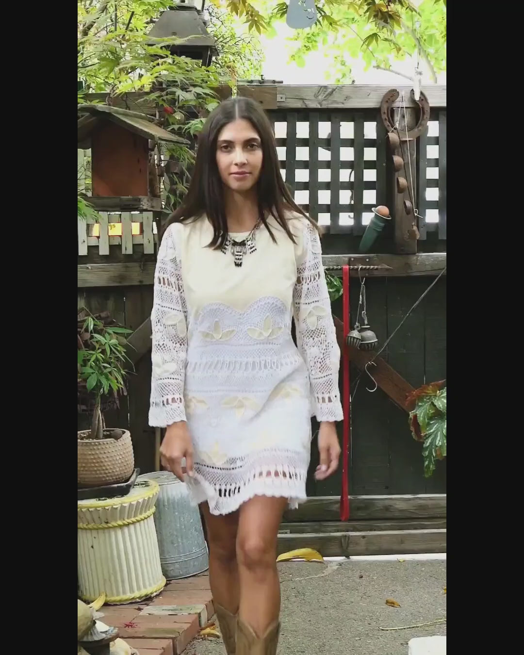 Video. Natural raw silk and artisan hand crochet detail intermix in this mini dress with flared bell sleeves and a comfortable fit. This boho chic dress zips up the back, tapers in at the waist, and is perfect as a beach coverup or a highlight to your vintage wardrobe. Pair it with sandals, or sass it up with cowboy boots and a bold, vintage necklace. Colors: Natural color raw silk and white crochet