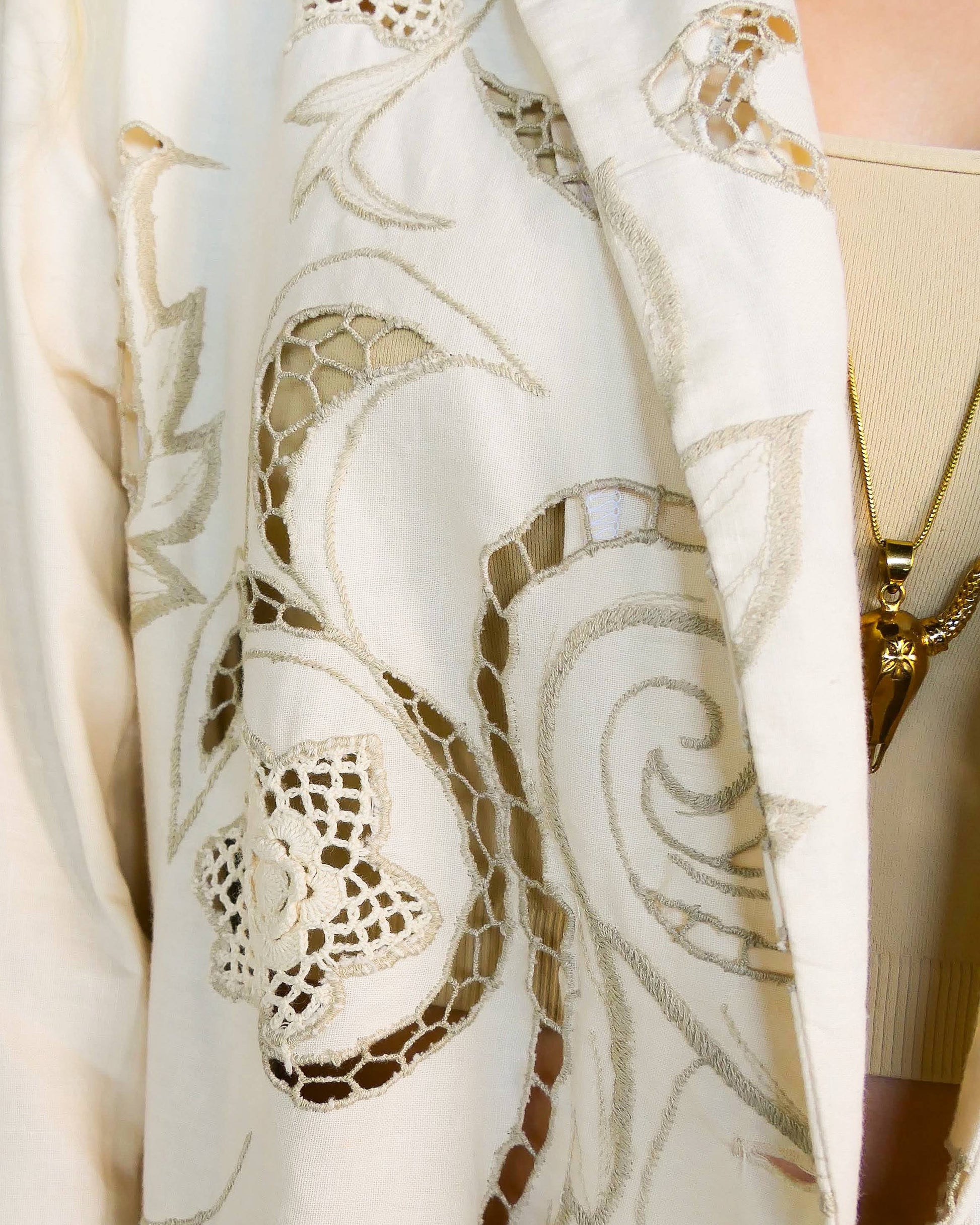 Lim's Vintage oversized cotton blazer with embroidered floral and leaf motif: Your everyday oversized cotton blazer that will put a definite skip in your step. This blazer is made from our Lim's Vintage cutout and embroidered fabric with a floral and leaf motif, and hand crocheted embellishments throughout. Comfortable, lightweight, and falls below the hip.