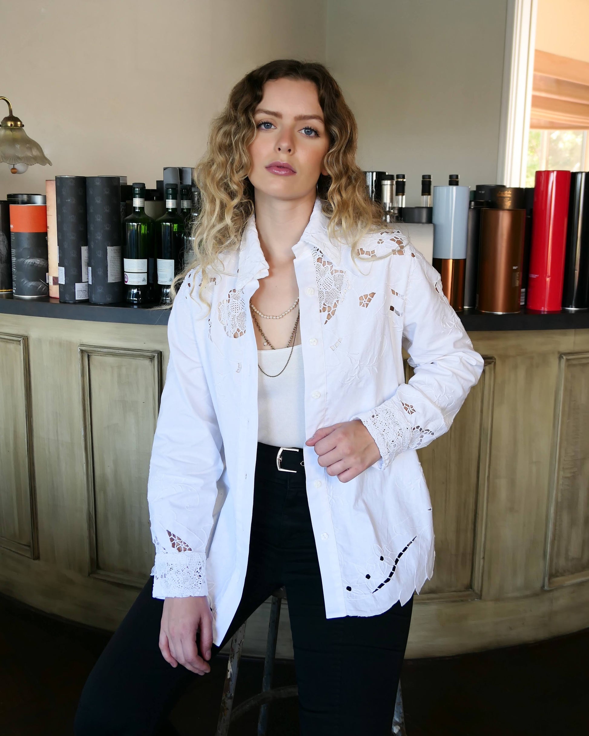 Uplift your everyday wardrobe with this cotton long sleeve shirt made with our vintage cutout and hand embroidered fabric. Embroidered and cutout detail in the collar, cuffs, and hemline make this shirt ultra-feminine and unique.  Note that the fabric is made with a thicker cotton fabric.  Comes in Small, Medium, and Large sizes.  