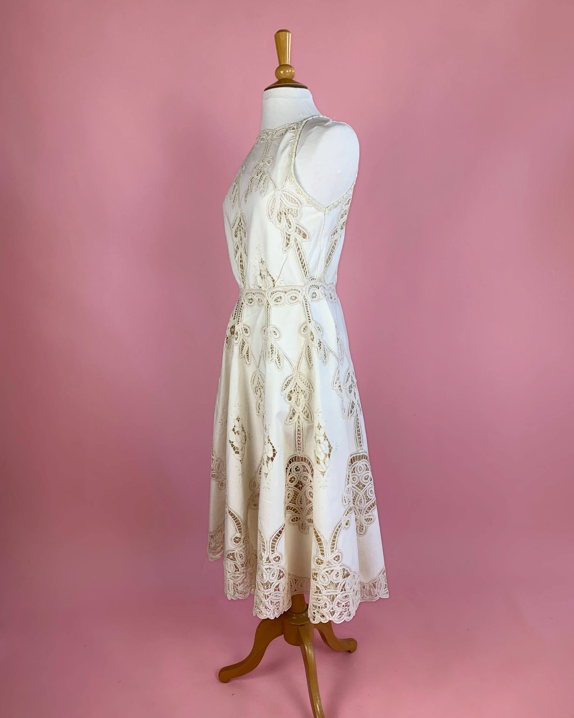 Lim's Vintage Battenberg lace midi length halter dress with a fitted waist and flared skirt.  Buttons up the back.    Measurements: *  Small:  Bust 36"   Waist 30"   Length: 46"     Medium:   Bust 38" Waist 32" Length 46" Large:  Bust 40" Waist 34" Length 46" Color: Natural  Material: 100% cotton
