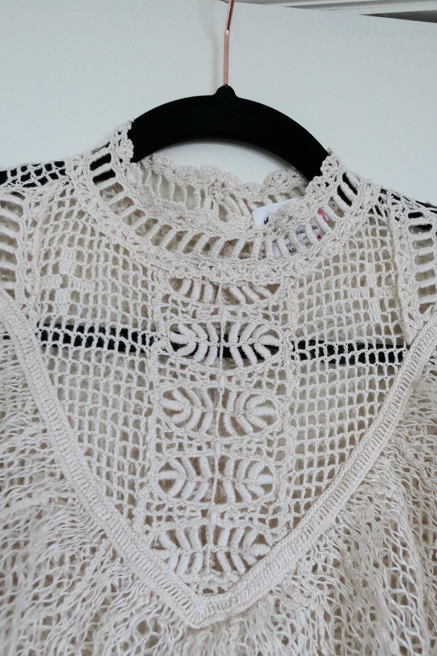 Our one-of-a-kind Lim's original hand crocheted maxi dress from the 1980s, worn by Jane Fonda and once even copied by a famous designer (who shall not be named here) and placed in a major fashion magazine ad. We have only two originals of this dress left in Small and Medium sizes.  Ruffles around the collar line and a two-tiered ruffle at the bottom hem add a boho chic, feminine touch.  The dress is reversible and can be worn with the buttons going up the front or back of the dress.